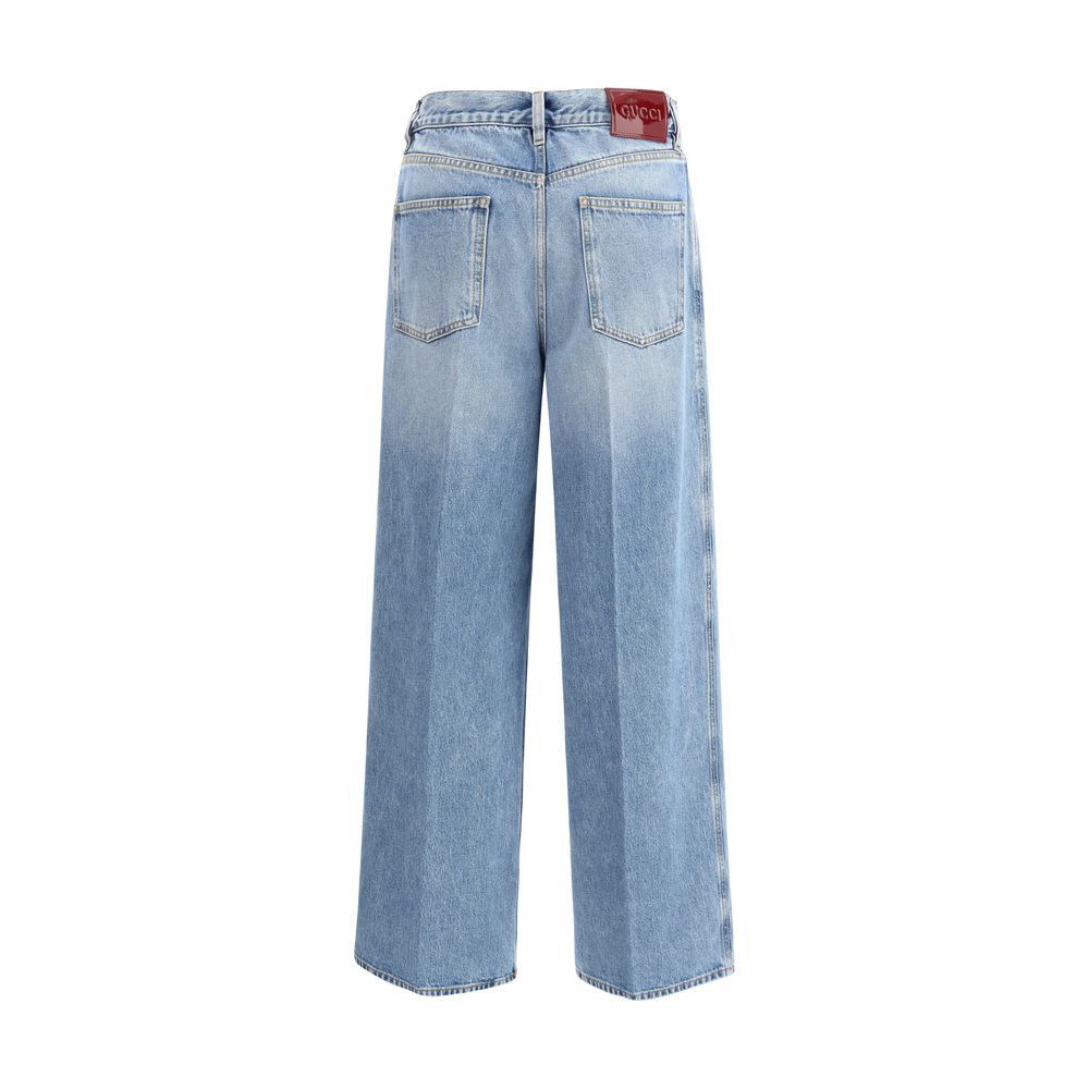 Light Blue Cotton Jeans DenimGucci’s wide leg Jeans feature a faded effect and light wash that give a vintage yet modern allure. With a high waist and belt loops, they offer a comfortable and defined fit. The button and zipper closure ensures practicality