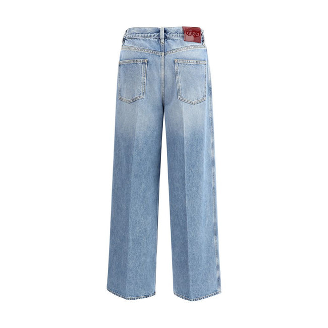 Light Blue Cotton Jeans DenimGucci’s wide leg Jeans feature a faded effect and light wash that give a vintage yet modern allure. With a high waist and belt loops, they offer a comfortable and defined fit. The button and zipper closure ensures practicality