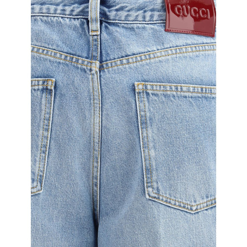 Light Blue Cotton Jeans DenimGucci’s wide leg Jeans feature a faded effect and light wash that give a vintage yet modern allure. With a high waist and belt loops, they offer a comfortable and defined fit. The button and zipper closure ensures practicality