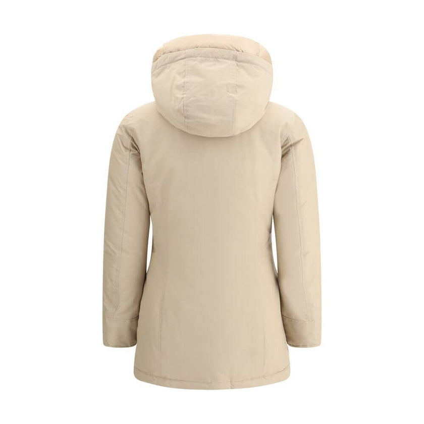 Beige Cotton ParkaArctic parka Jacket by Woolrich is made of durable Ramar Cloth fabric, treated with Teflon coating to provide protection from water and wind. Featuring a front zipper and concealed button closure, it has a protective hood, Velcro closure