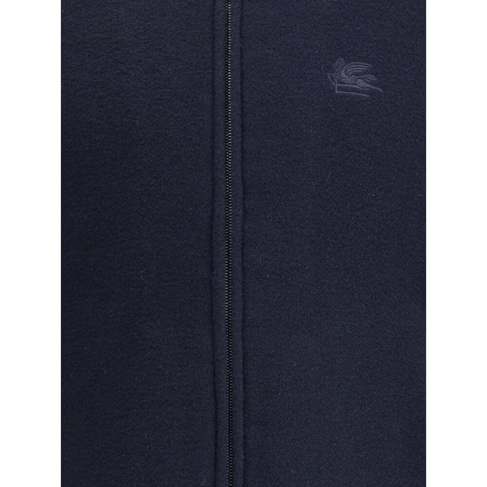 Blue Wool BomberWool bomber Jacket by Etro features a ribbed collar, cuffs and hem, and front zipper closure. The design is completed by two side welt pockets and the iconic tone-on-tone embroidered Pegasus logo on the front for a distinctive and elegant