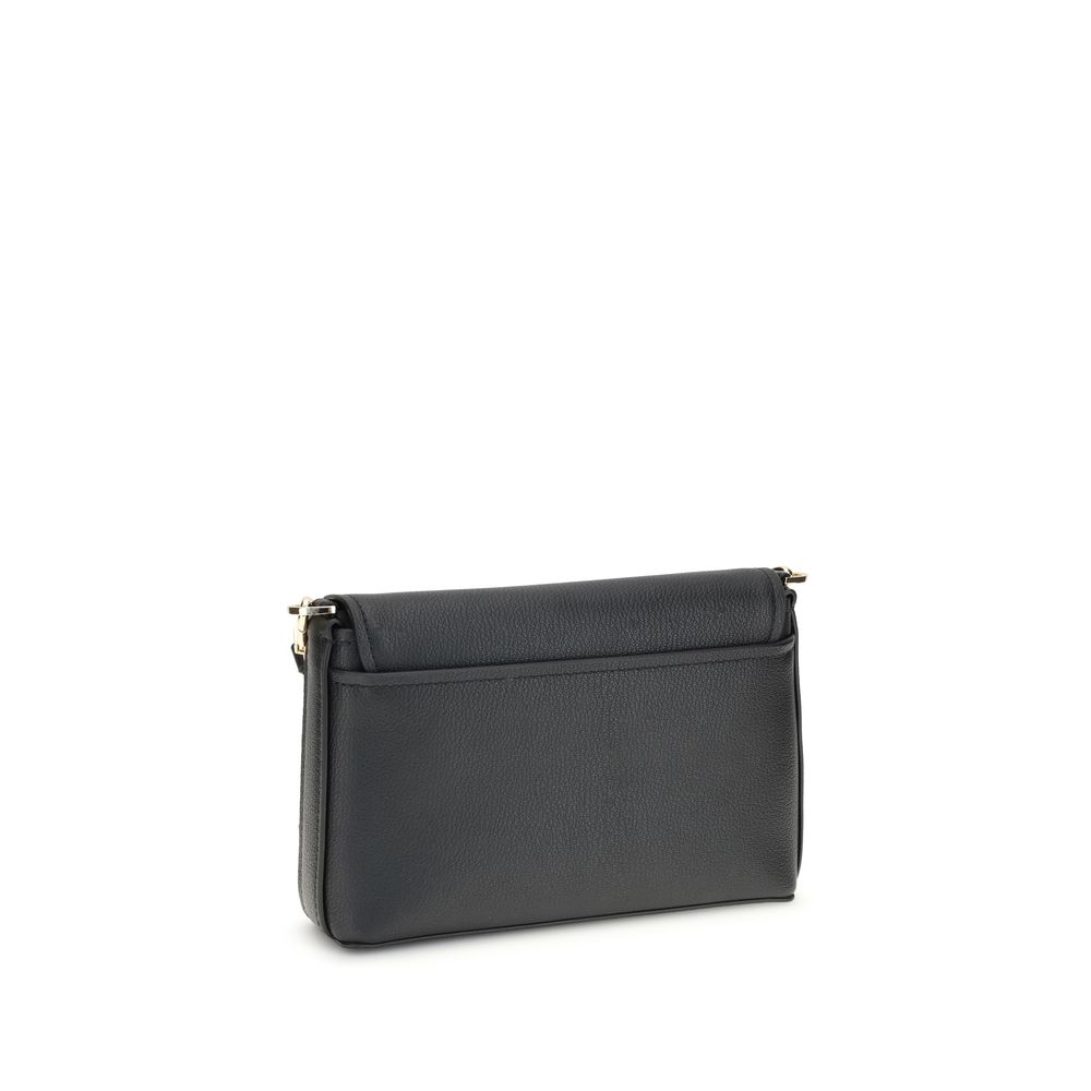 Small Nessa Shoulder BagThe small Nessa Shoulder Bag by Michael Kors combines practicality and style in a compact design. Equipped with a removable and adjustable shoulder strap, it features a flap and snap closure. The logo on the front adds a distinctiv