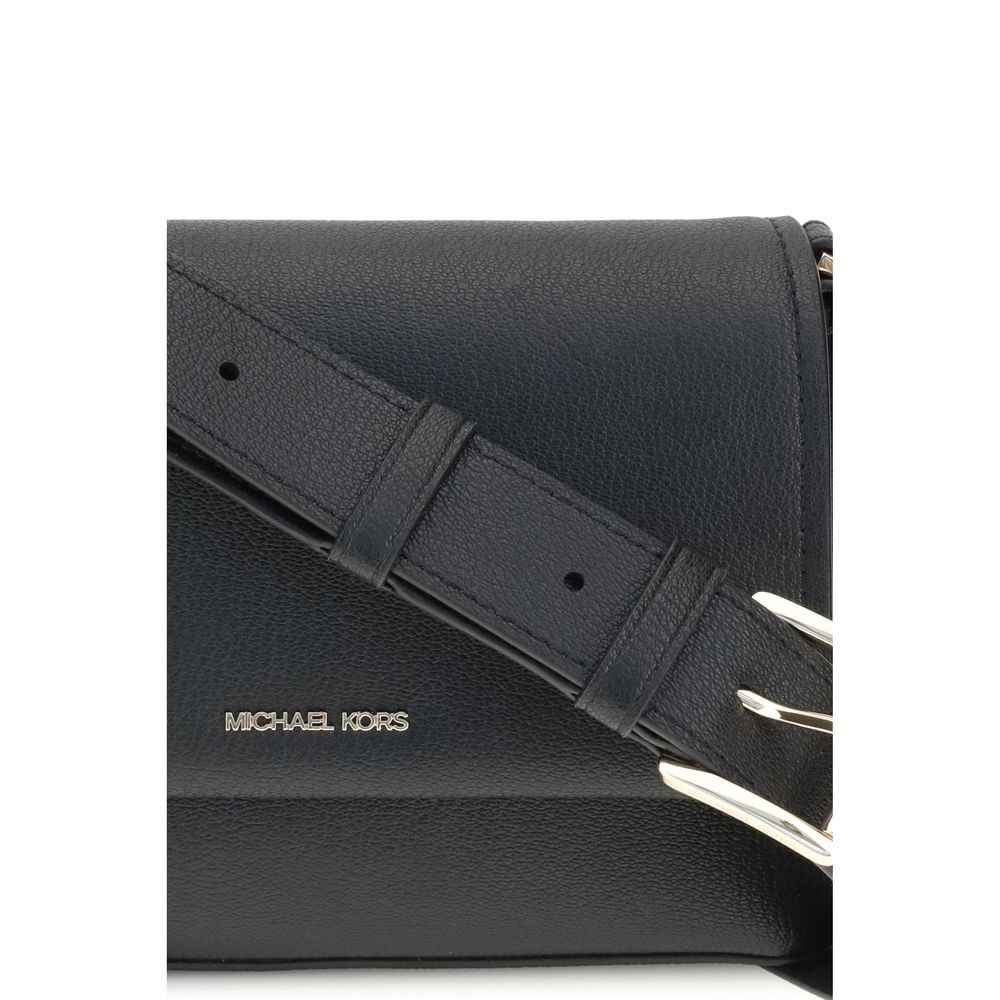 Small Nessa Shoulder BagThe small Nessa Shoulder Bag by Michael Kors combines practicality and style in a compact design. Equipped with a removable and adjustable shoulder strap, it features a flap and snap closure. The logo on the front adds a distinctiv