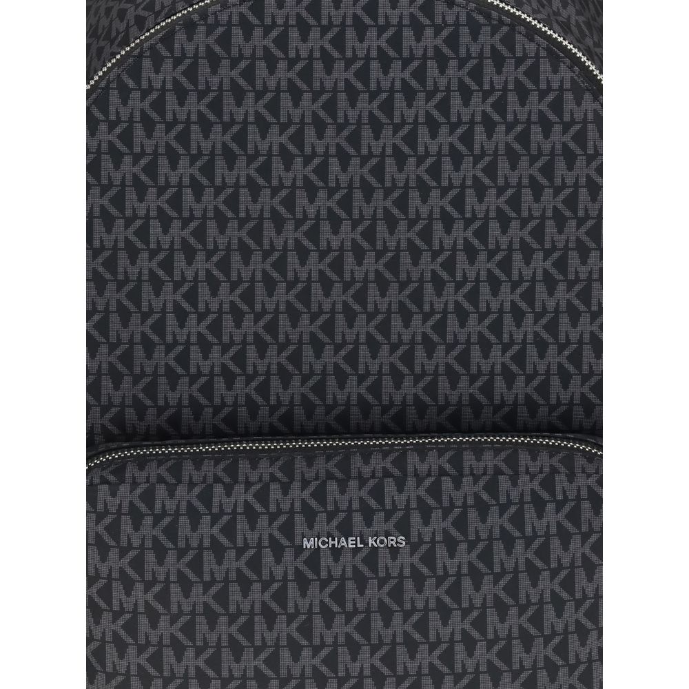 Black Polyester BackpackThe Tanner large Logo Print Backpack by Michael Kors is crafted from logo-printed canvas for a timeless and sophisticated look. The minimalist design is enhanced by two exterior pouch pockets and a zippered front clutch, offering p