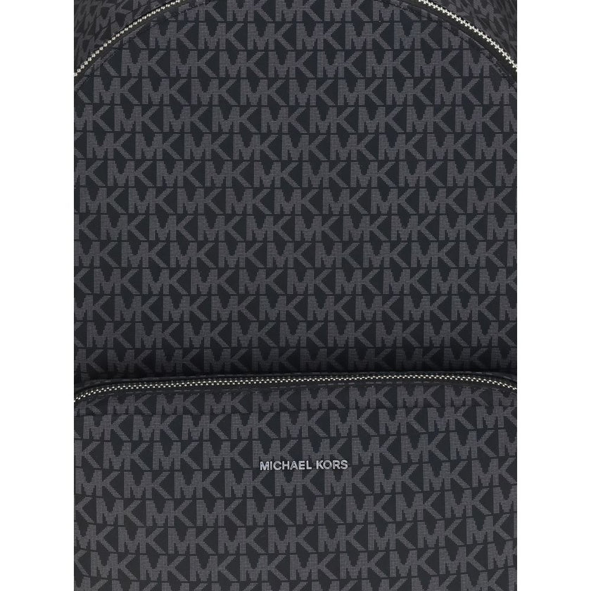 Black Polyester BackpackThe Tanner large Logo Print Backpack by Michael Kors is crafted from logo-printed canvas for a timeless and sophisticated look. The minimalist design is enhanced by two exterior pouch pockets and a zippered front clutch, offering p
