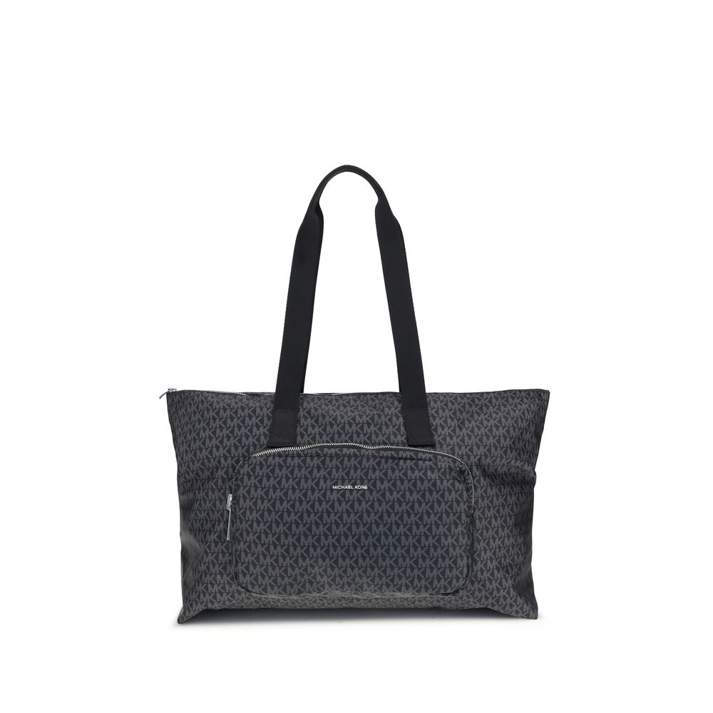 Black Polyester Shoulder BagThe Michael Kors Tanner large Tote Bag is perfect for the stylish and practical traveler. With its reversible design, it offers two looks in one: iconic logo print on one side and solid color on the other. Foldable inside itsel