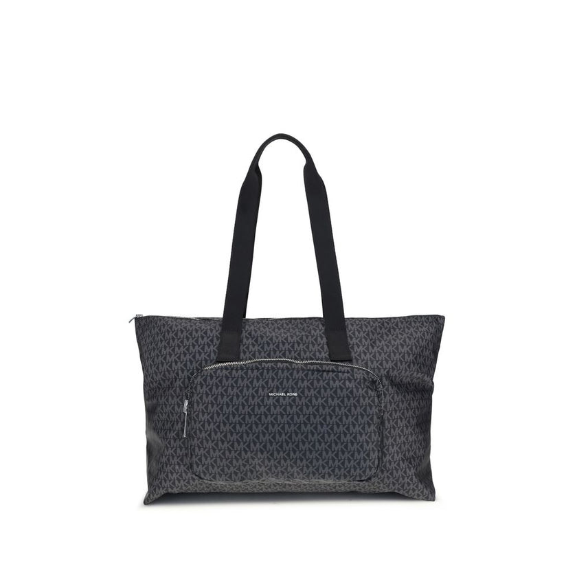 Black Polyester Shoulder BagThe Michael Kors Tanner large Tote Bag is perfect for the stylish and practical traveler. With its reversible design, it offers two looks in one: iconic logo print on one side and solid color on the other. Foldable inside itsel
