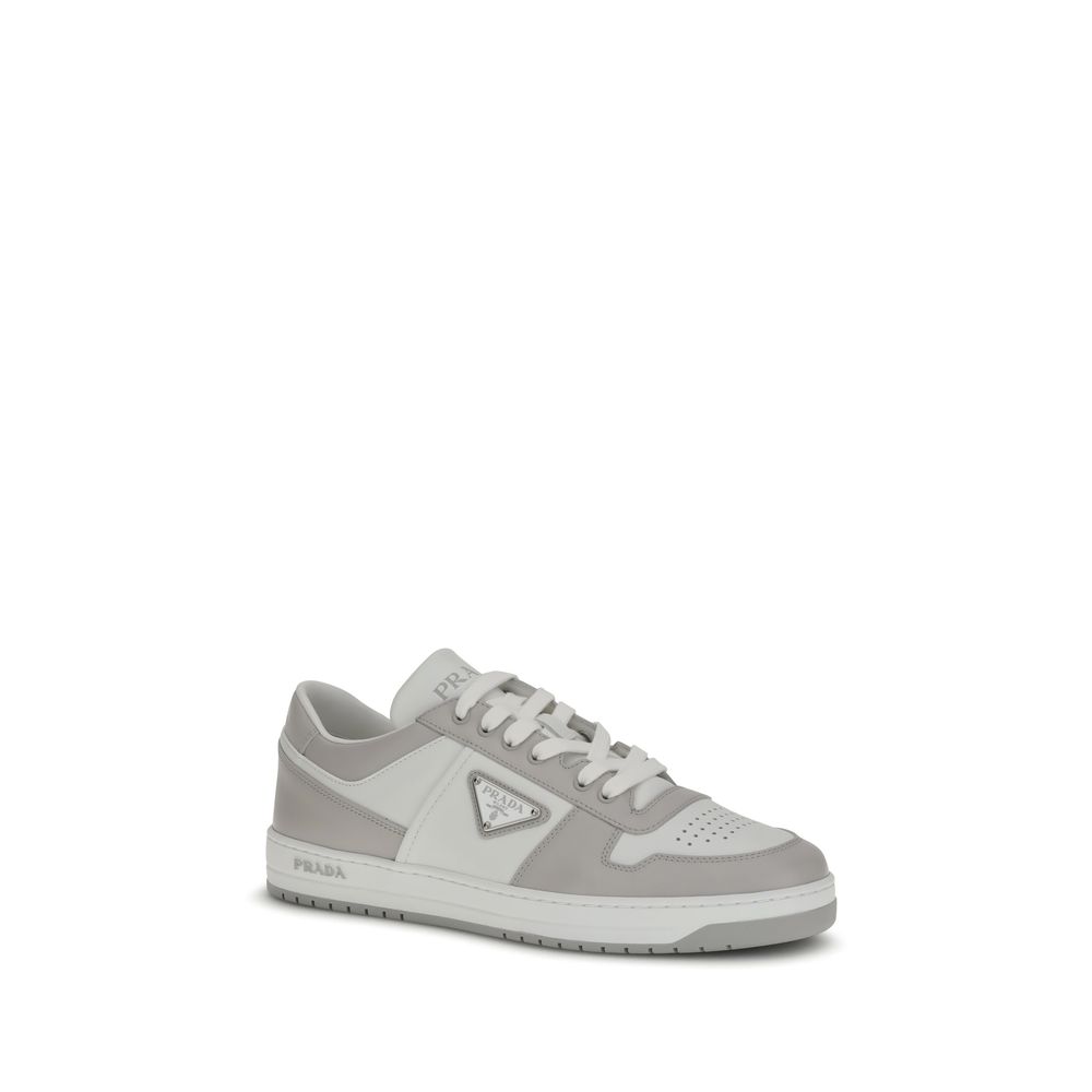 Downtown SneakersPrada’s Downtown Sneakers are made of smooth leather and feature an embossed logo on the back and the iconic logo triangle on the side. They feature a lace-up closure, perforated toe and printed logo on the padded tongue, as well as an in