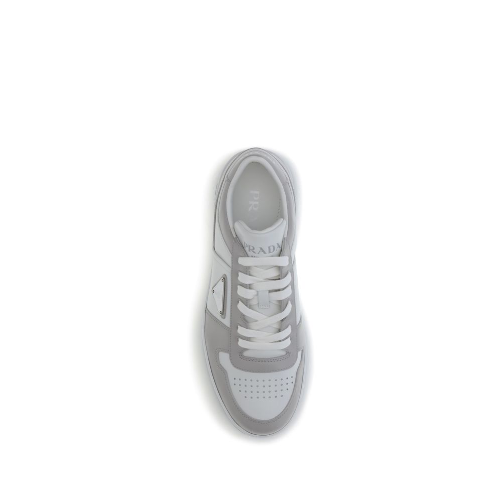 Downtown SneakersPrada’s Downtown Sneakers are made of smooth leather and feature an embossed logo on the back and the iconic logo triangle on the side. They feature a lace-up closure, perforated toe and printed logo on the padded tongue, as well as an in