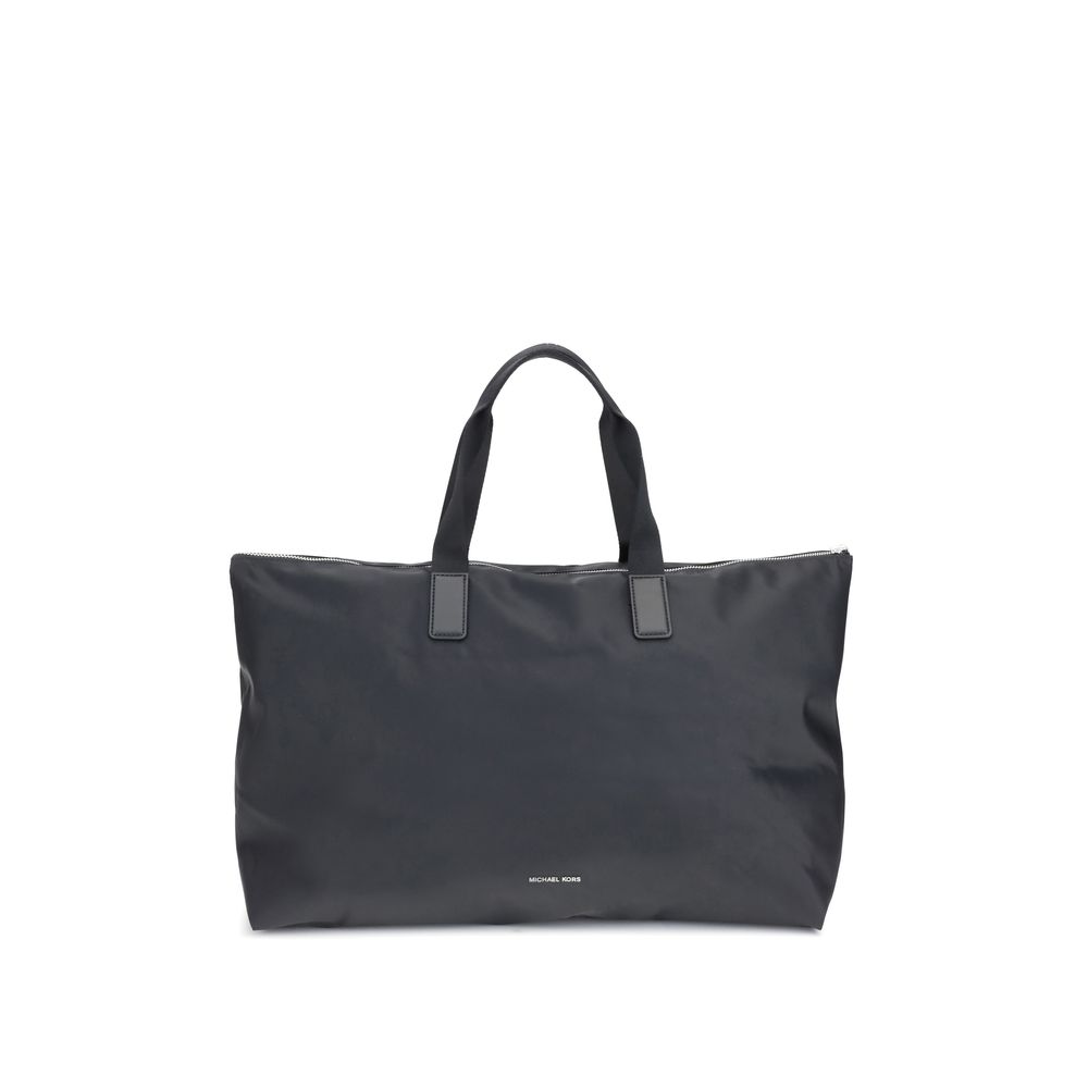 Black Polyester Shoulder BagThe Michael Kors Tanner large Tote Bag is perfect for the stylish and practical traveler. With its reversible design, it offers two looks in one: iconic logo print on one side and solid color on the other. Foldable inside itsel