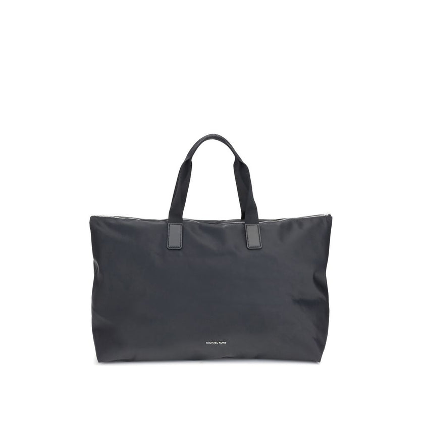 Black Polyester Shoulder BagThe Michael Kors Tanner large Tote Bag is perfect for the stylish and practical traveler. With its reversible design, it offers two looks in one: iconic logo print on one side and solid color on the other. Foldable inside itsel