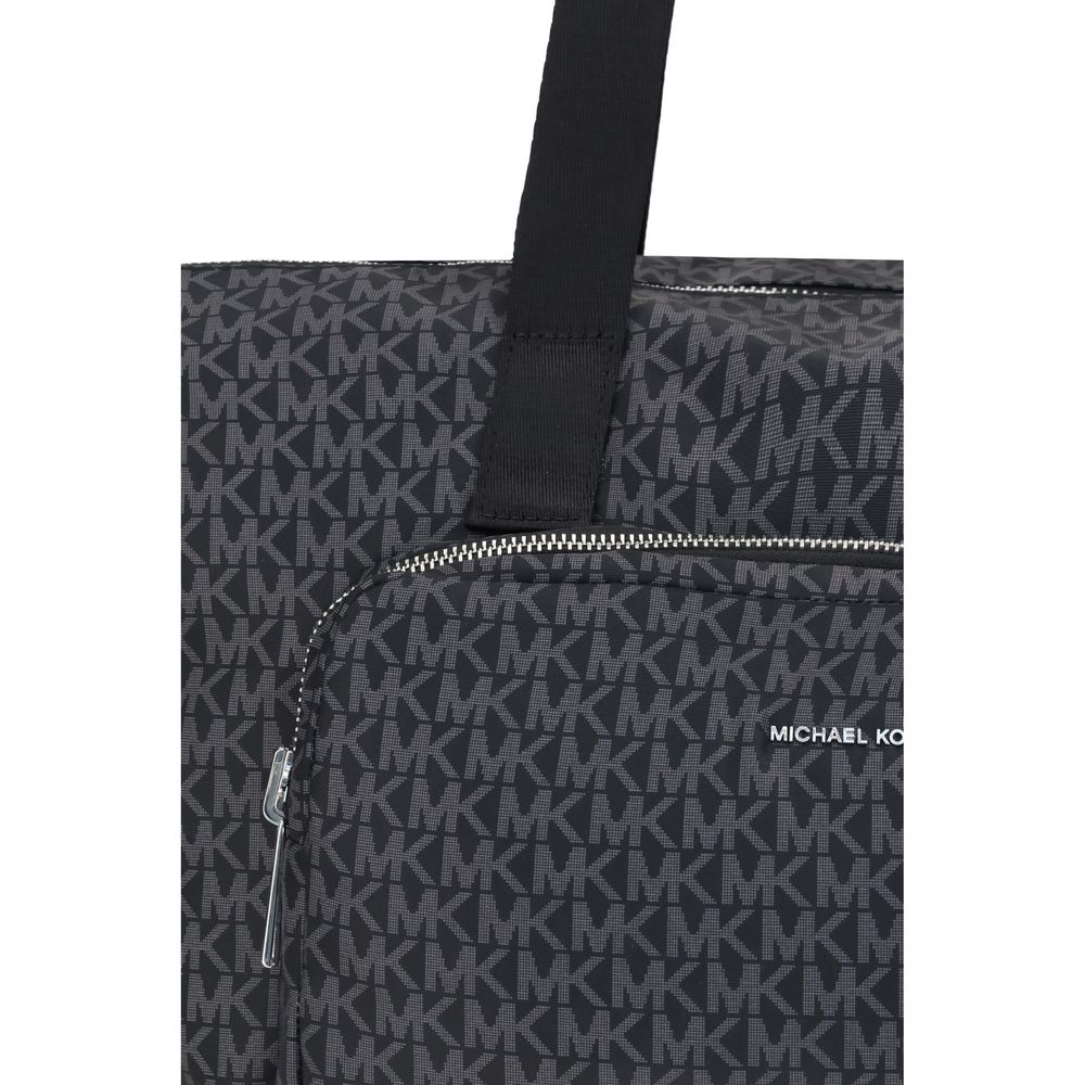 Black Polyester Shoulder BagThe Michael Kors Tanner large Tote Bag is perfect for the stylish and practical traveler. With its reversible design, it offers two looks in one: iconic logo print on one side and solid color on the other. Foldable inside itsel