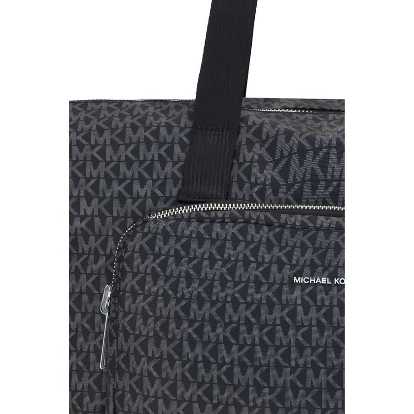 Black Polyester Shoulder BagThe Michael Kors Tanner large Tote Bag is perfect for the stylish and practical traveler. With its reversible design, it offers two looks in one: iconic logo print on one side and solid color on the other. Foldable inside itsel