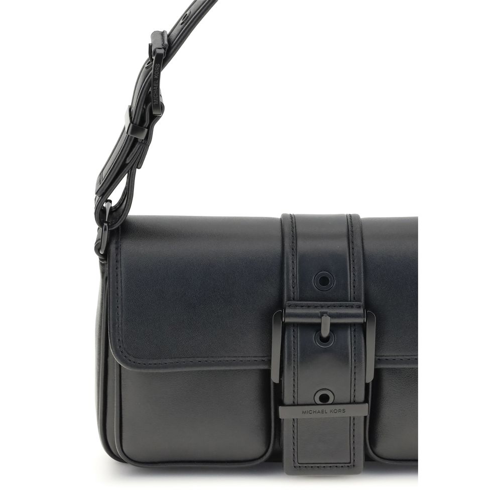 Black Calf Leather Bos Taurus Shoulder BagThe Colby medium Shoulder Bag by Michael Kors features an elegant rectangular silhouette enhanced by a bold buckle. Made of soft leather, it is perfect for carrying under the arm thanks to its flat handle. The fla