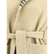 Beige Wool CoatBurberry’s reversible wool robe Coat is a versatile and refined garment, perfect for those seeking elegance and functionality in one piece. It features an understated solid color on one side and a classic Burberry Check pattern in the disti