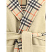 Beige Wool CoatBurberry’s reversible wool robe Coat combines style and practicality in one. On one side it features an elegant solid color, while on the other it sports the iconic Burberry Check pattern. Complete with a hood, it offers a comfortable fit a