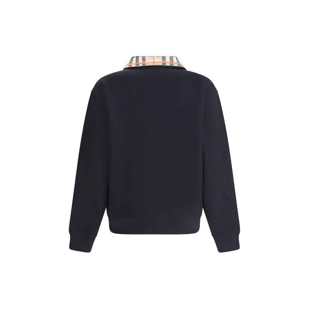 Black Cotton SweatshirtCotton Sweatshirt by Burberry featuring a classic collar and the brand’s iconic Archivio Check pattern. It features a half-length front zipper, ribbed cuffs and hem for a comfortable, finished fit. Embroidered on the front are the i