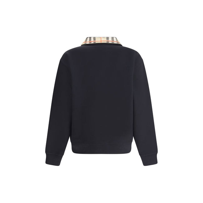 Black Cotton SweatshirtCotton Sweatshirt by Burberry featuring a classic collar and the brand’s iconic Archivio Check pattern. It features a half-length front zipper, ribbed cuffs and hem for a comfortable, finished fit. Embroidered on the front are the i