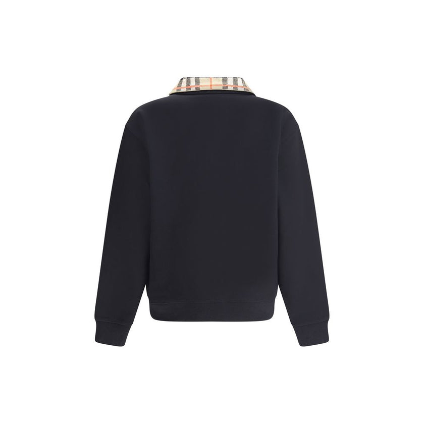 Black Cotton SweatshirtCotton Sweatshirt by Burberry featuring a classic collar and the brand’s iconic Archivio Check pattern. It features a half-length front zipper, ribbed cuffs and hem for a comfortable, finished fit. Embroidered on the front are the i