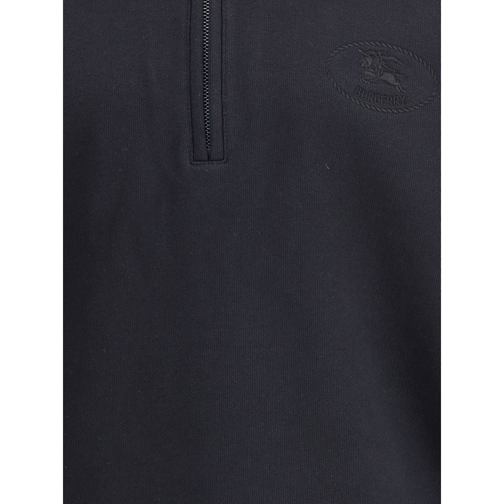 Black Cotton SweatshirtCotton Sweatshirt by Burberry featuring a classic collar and the brand’s iconic Archivio Check pattern. It features a half-length front zipper, ribbed cuffs and hem for a comfortable, finished fit. Embroidered on the front are the i