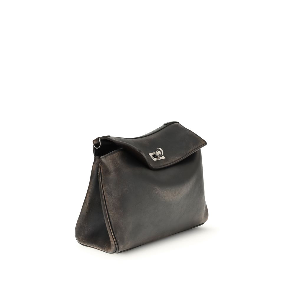 Brown Lamb Ovis Aries Aries Shoulder BagBalenciaga’s Rodeo small Shoulder Bag, designed for the modern man, is crafted from two-tone calfskin with a distressed effect, giving it a bold, contemporary feel. The messenger design is complemented by an adjusta