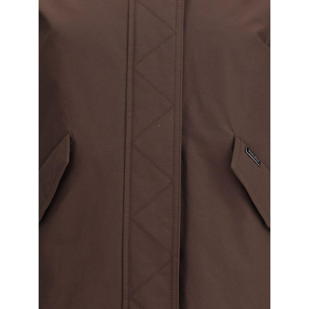 Brown Cotton Full-Length JacketWoolrich’s padded Jacket is a practical and warm garment featuring a hooded design that offers added protection. The front closure combines a double-slider zipper and snaps for optimal security and comfort. Completing the de