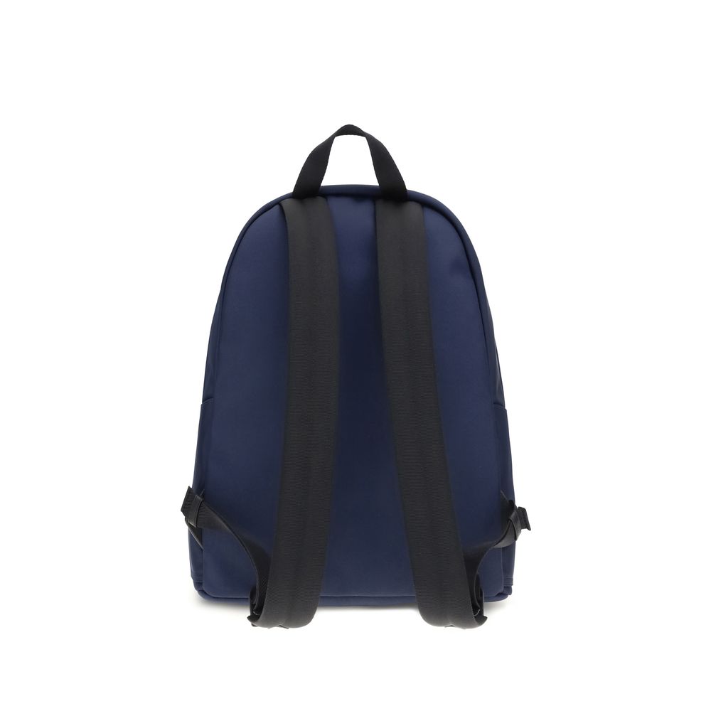 Blue Nylon BackpackMoncler’s New Pierrick Backpack is made of water-repellent nylon, with a lining of the same material for durability and protection from the elements. It features leather trim and a smooth leather handle for a touch of elegance. Adjustab