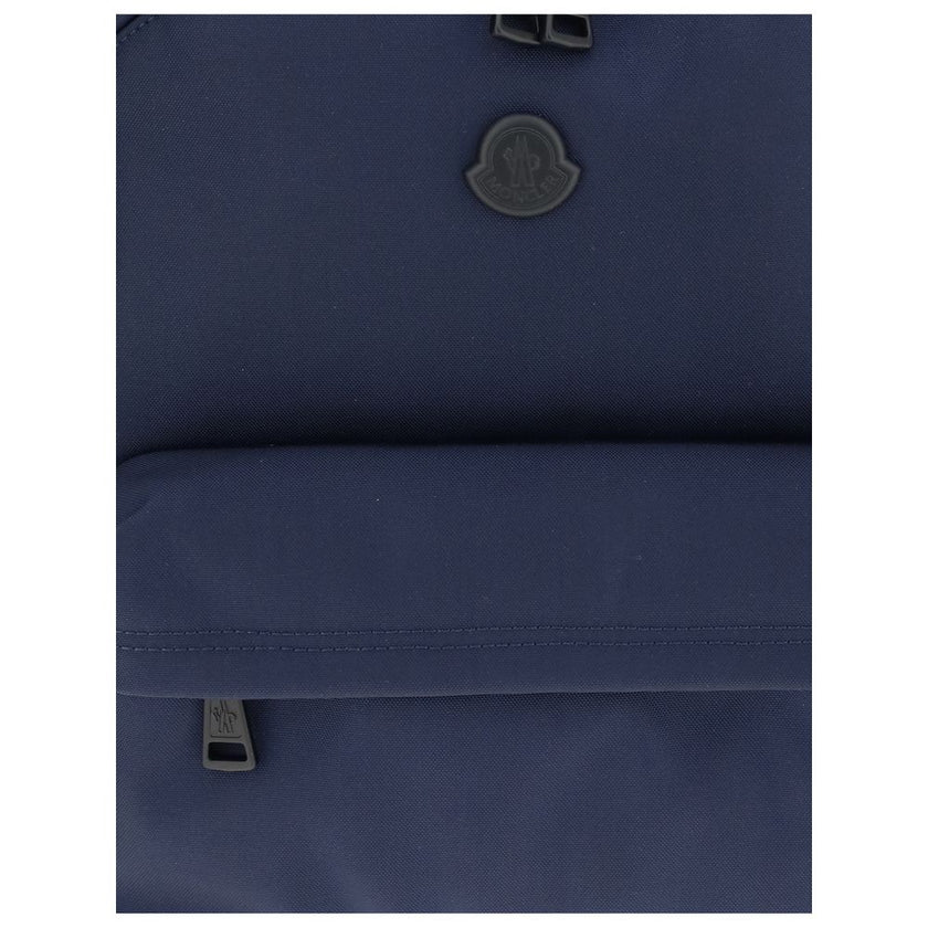 Blue Nylon BackpackMoncler’s New Pierrick Backpack is made of water-repellent nylon, with a lining of the same material for durability and protection from the elements. It features leather trim and a smooth leather handle for a touch of elegance. Adjustab