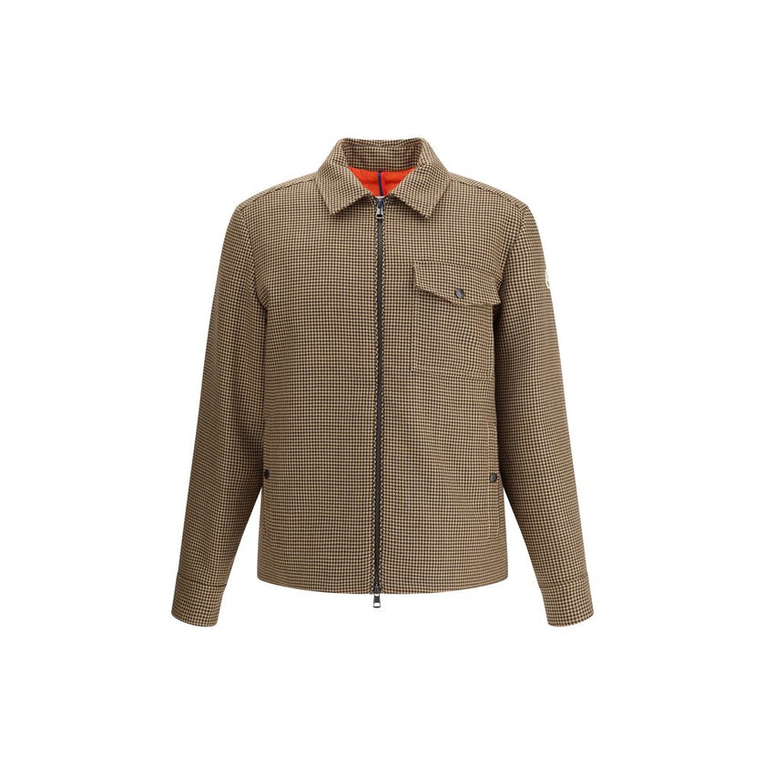 Escaut Down JacketMoncler’s Escaut virgin wool Down Jacket features a refined design with a classic collar and a double-slider zip fastening at the front. It features two side welt pockets and a flap welt pocket on the front. The logo patch on the left sl