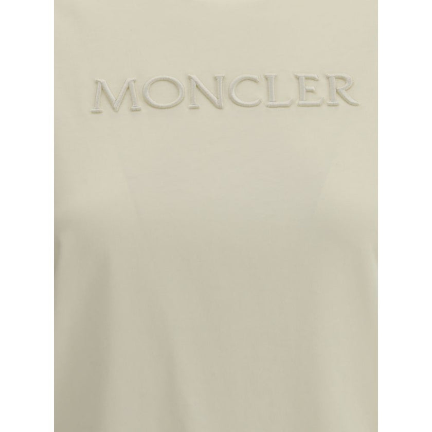 Cream Cotton T-ShirtSoft cotton T-Shirt by Moncler designed for an essential and refined look. The design features a ribbed crew neck that ensures comfort and an impeccable fit. On the front, the iconic Moncler monogram is tone-on-tone embroidered for a d
