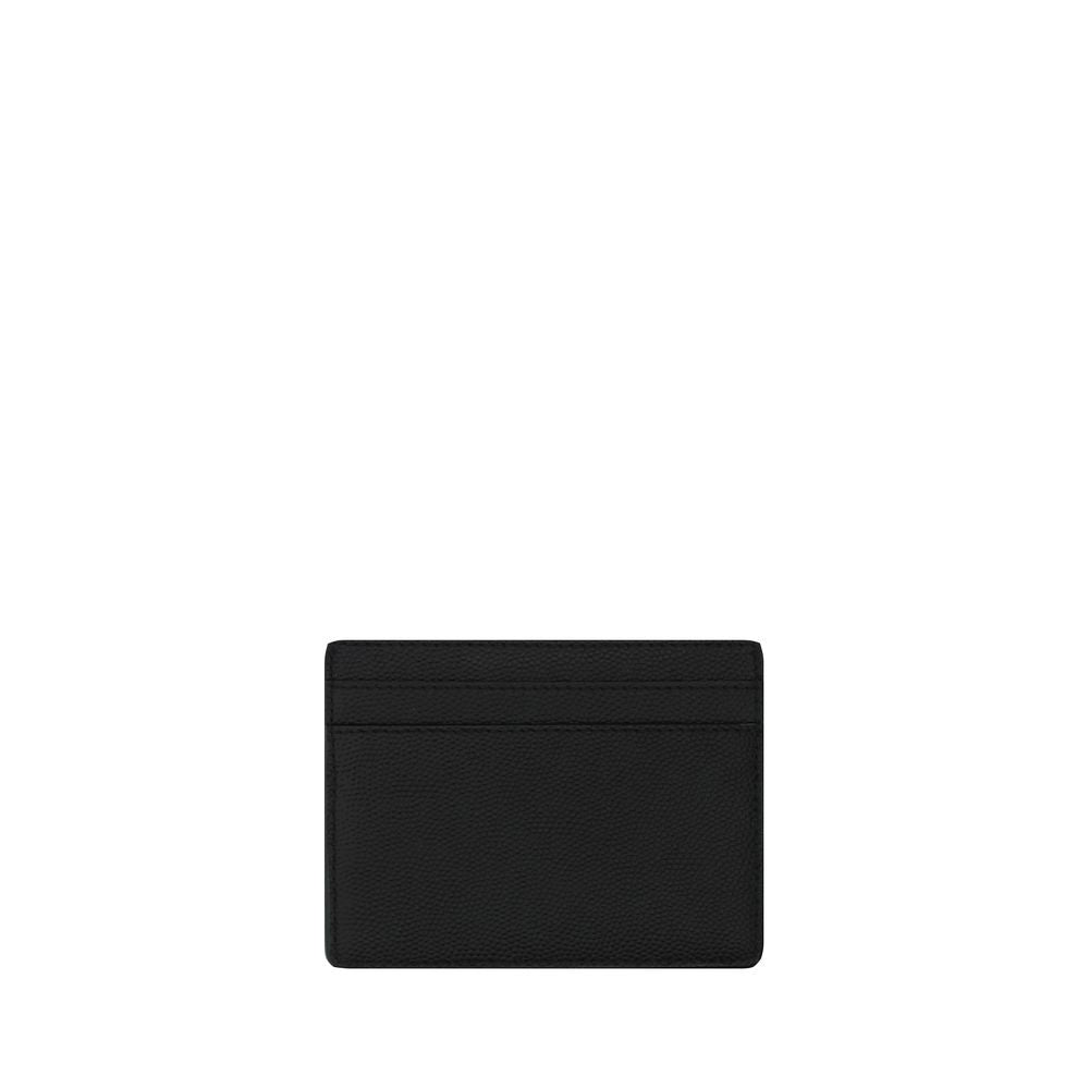 Black Calf Leather Bos Taurus WalletLeather Grain De Poudre Credit Card Holder from Saint Laurent, two slots card on front and back, one open pocket for coins, embossed brand logo on front. Season: AW25 Dimension: 10×10 Composition: 100% Calf Leather Bos