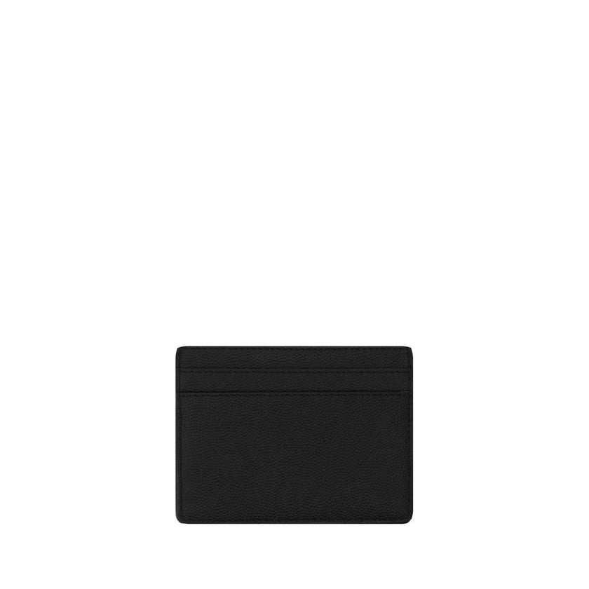 Black Calf Leather Bos Taurus WalletLeather Grain De Poudre Credit Card Holder from Saint Laurent, two slots card on front and back, one open pocket for coins, embossed brand logo on front. Season: AW25 Dimension: 10×10 Composition: 100% Calf Leather Bos