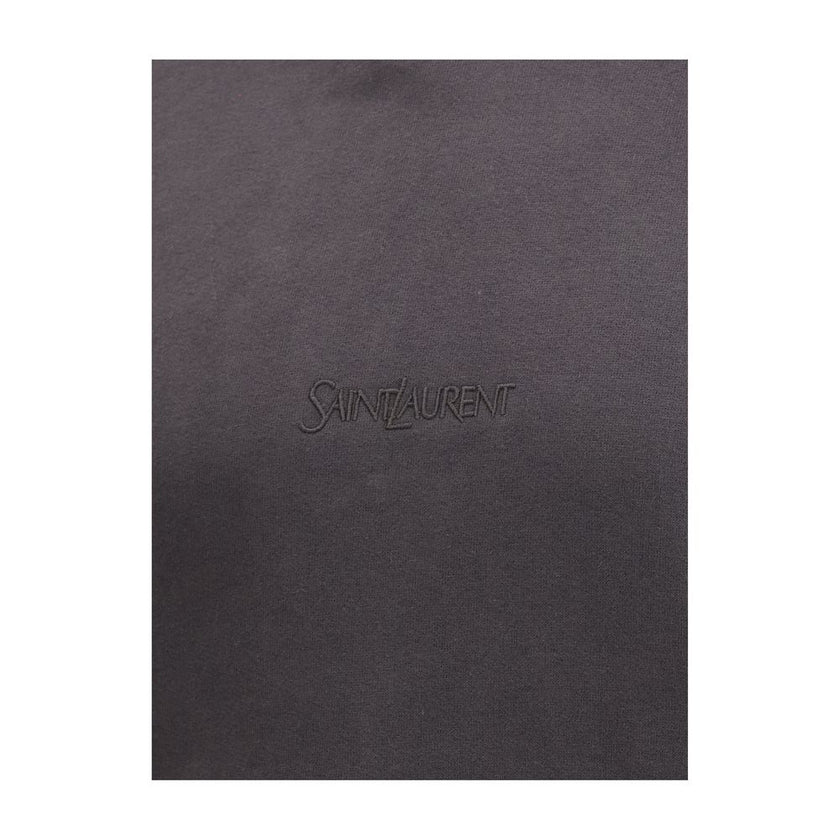 Black Cotton SweatshirtThe Saint Laurent Hoodie is a garment that combines comfort and urban style, with a simple yet refined design. The adjustable drawstring hood offers functionality and the possibility of customizing the fit, while the kangaroo pocket