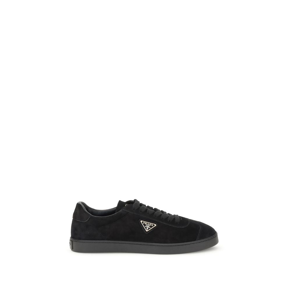Black Calf Leather Bos Taurus Low Top SneakersPrada’s suede Sneakers combine contemporary style with everyday comfort. Featuring a flat rubber sole and round toe, they are distinguished by the iconic triangular side-applied plaque and tone-on-tone logo on