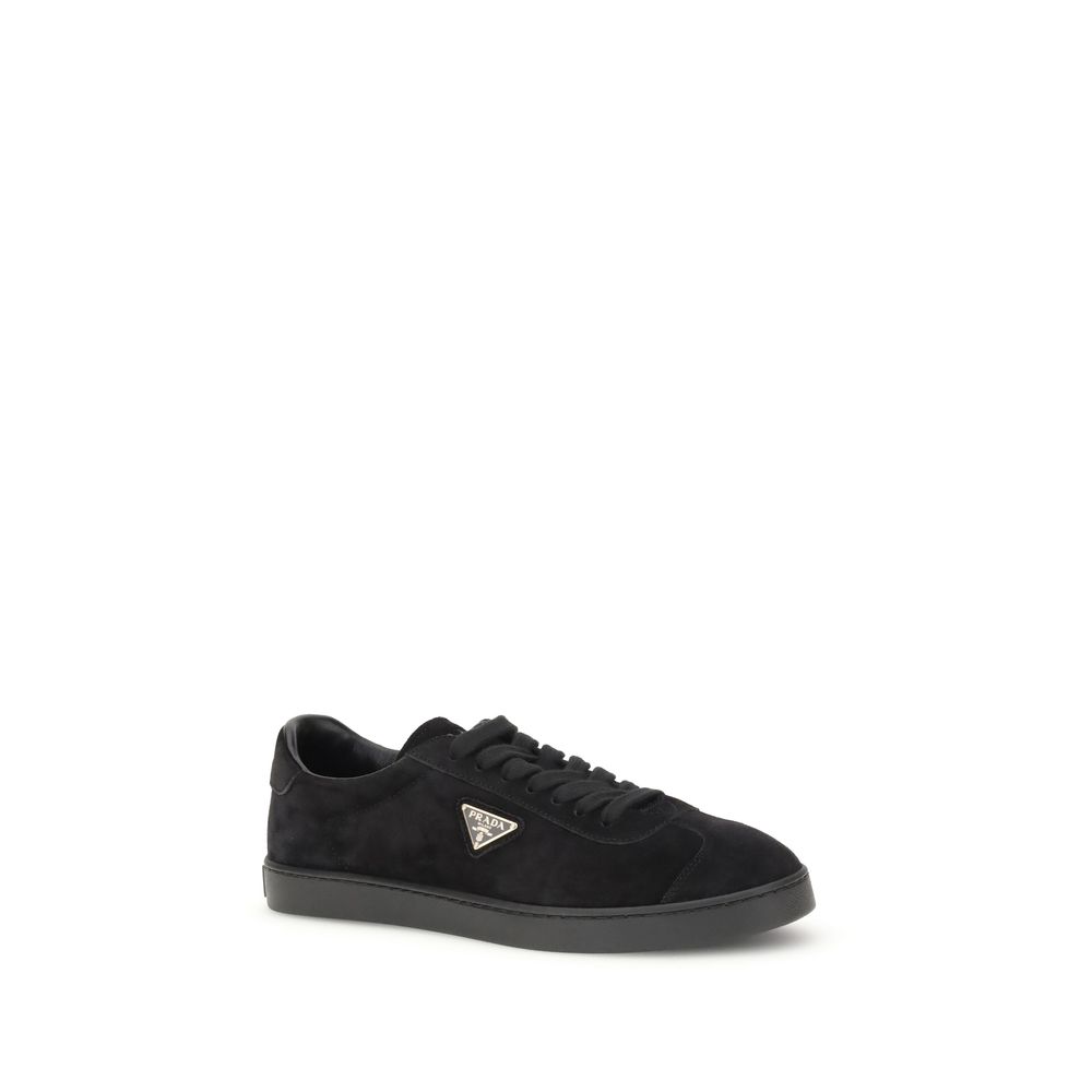 Black Calf Leather Bos Taurus Low Top SneakersPrada’s suede Sneakers combine contemporary style with everyday comfort. Featuring a flat rubber sole and round toe, they are distinguished by the iconic triangular side-applied plaque and tone-on-tone logo on