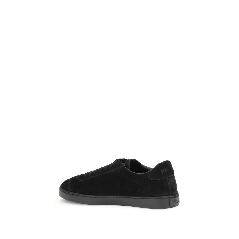 Black Calf Leather Bos Taurus Low Top SneakersPrada’s suede Sneakers combine contemporary style with everyday comfort. Featuring a flat rubber sole and round toe, they are distinguished by the iconic triangular side-applied plaque and tone-on-tone logo on