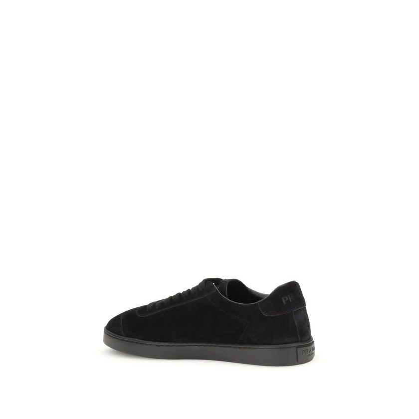 Black Calf Leather Bos Taurus Low Top SneakersPrada’s suede Sneakers combine contemporary style with everyday comfort. Featuring a flat rubber sole and round toe, they are distinguished by the iconic triangular side-applied plaque and tone-on-tone logo on
