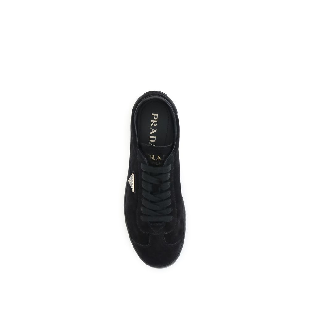 Black Calf Leather Bos Taurus Low Top SneakersPrada’s suede Sneakers combine contemporary style with everyday comfort. Featuring a flat rubber sole and round toe, they are distinguished by the iconic triangular side-applied plaque and tone-on-tone logo on