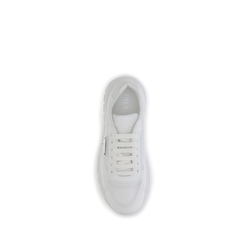 White Rubber Athletic SneakersPrada’s Prax 2.0 Sneakers combine contemporary design and iconic details. Made of technical fabric and mesh, they are embellished with the unmistakable enameled metal triangle logo. The polyester lace-up closure ensures a sec