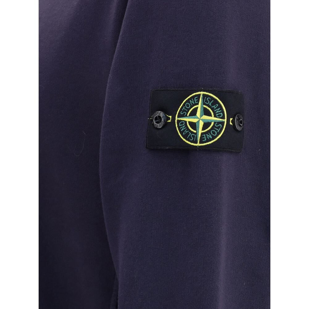 Logoed SweatshirtCotton Sweatshirt by Stone Island featuring a ribbed crew neck, a logo patch applied to the left sleeve and ribbed details on the cuffs and hem. The plush interior provides comfort and warmth, making this garment perfect for cooler days.