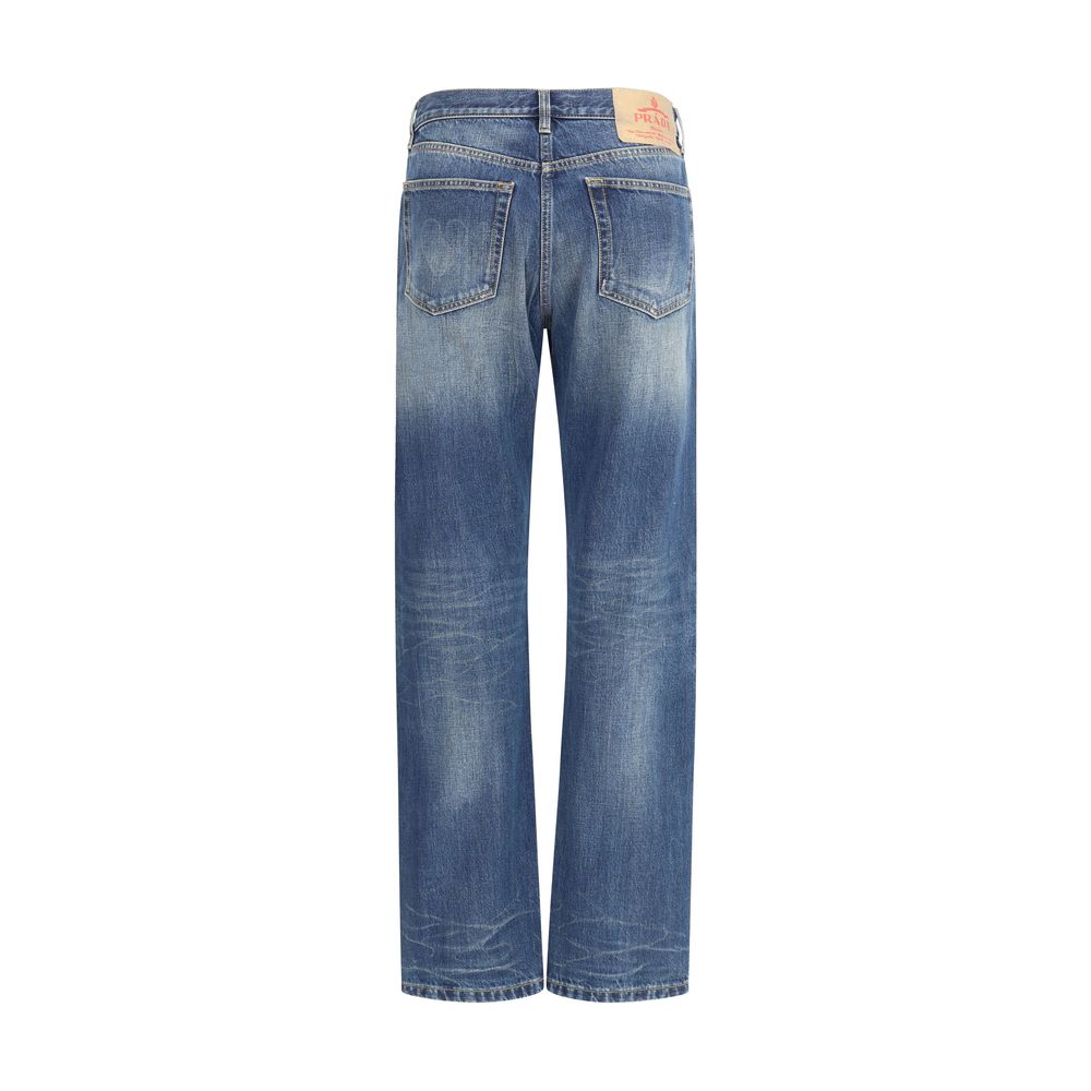Blue Cotton Straight-Leg JeansPrada’s Straight Jeans combine classic style with distinctive details. With five-pocket styling, they feature a front zip-and-button closure, belt loops at the waist and a logo patch on the back for a touch of contemporary el