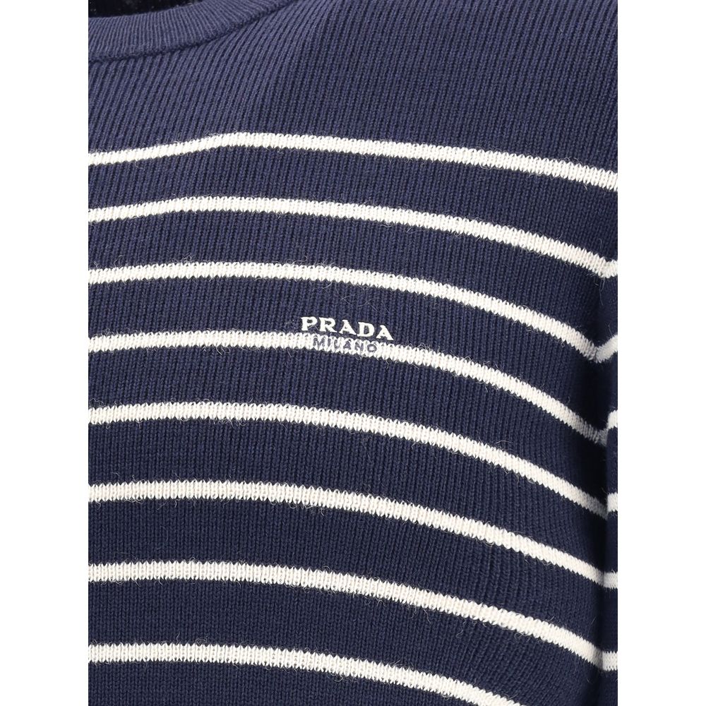 Blue Fleece Wool SweatshirtPrada’s virgin wool striped Sweater combines classicism and contemporary identity. Featuring a ribbed crew neck, it features a vibrant striped pattern and the iconic jacquard signature on the front, a distinctive detail that sig