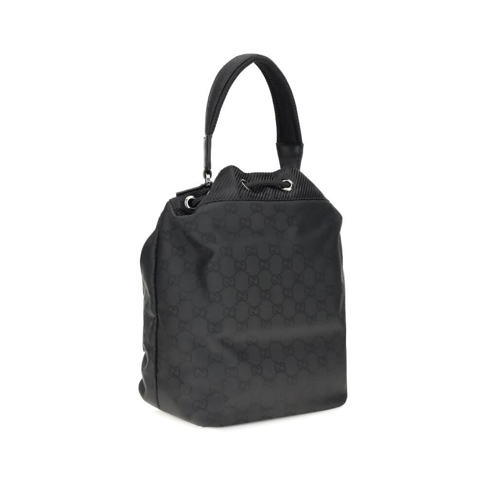 Black Polyamide Backet BagGucci’s Nylon Bucket Bag combines practicality and iconic style. Featuring a rigid handle and drawstring closure, it has two front zippered pockets for functional organization. The design is embellished with the iconic all-over G