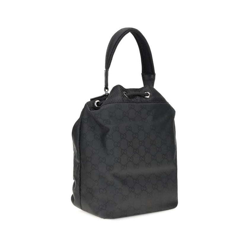 Black Polyamide Backet BagGucci’s Nylon Bucket Bag combines practicality and iconic style. Featuring a rigid handle and drawstring closure, it has two front zippered pockets for functional organization. The design is embellished with the iconic all-over G