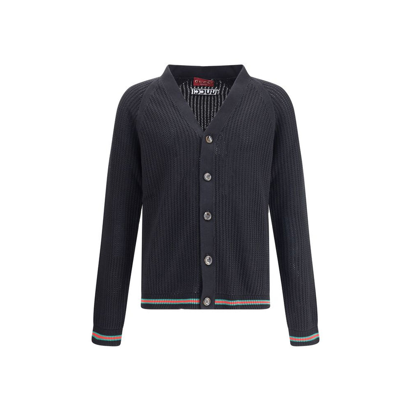 Black Cotton CardiganCotton cardigan from Gucci features a V-neck front and front button closure for a classic, refined style. Raglan sleeves ensure comfort and freedom of movement, while the knit weave lends a touch of elegant texture. Ribbed cuffs and h