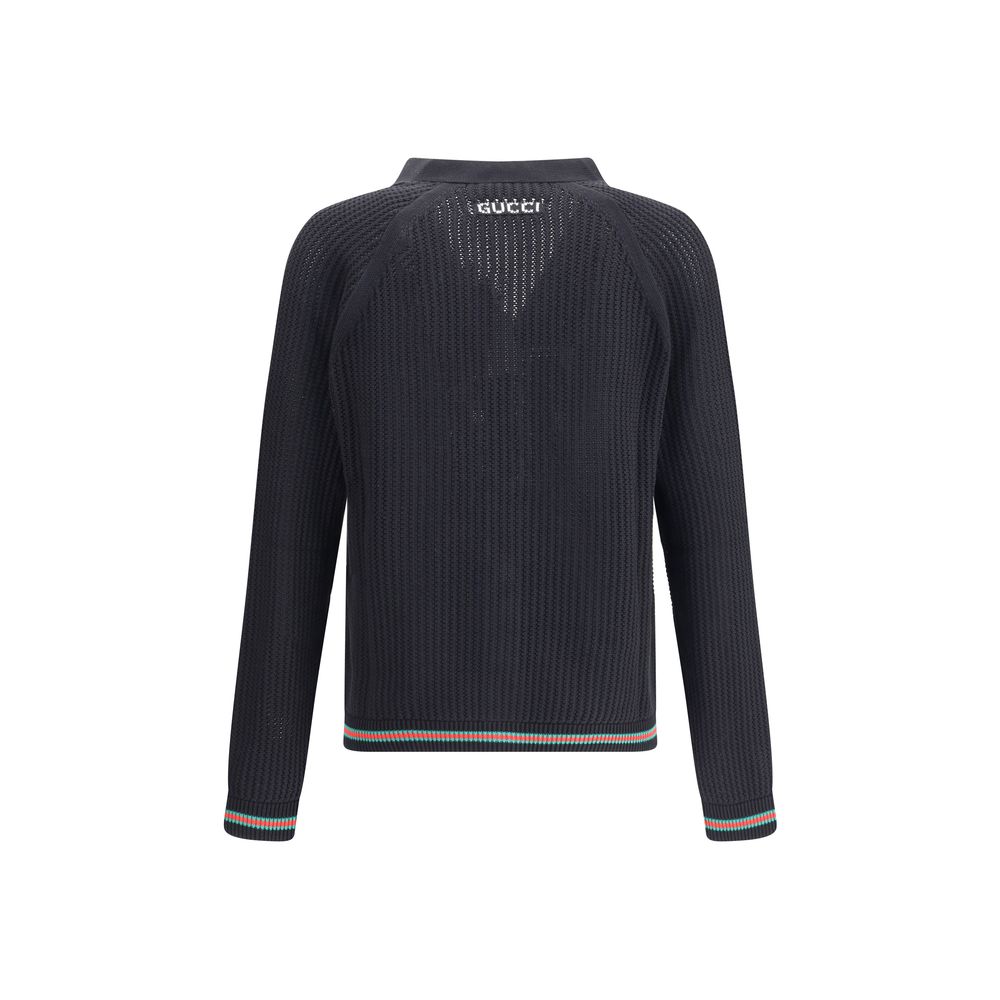 Black Cotton CardiganCotton cardigan from Gucci features a V-neck front and front button closure for a classic, refined style. Raglan sleeves ensure comfort and freedom of movement, while the knit weave lends a touch of elegant texture. Ribbed cuffs and h