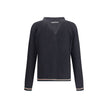 Black Cotton CardiganCotton cardigan from Gucci features a V-neck front and front button closure for a classic, refined style. Raglan sleeves ensure comfort and freedom of movement, while the knit weave lends a touch of elegant texture. Ribbed cuffs and h