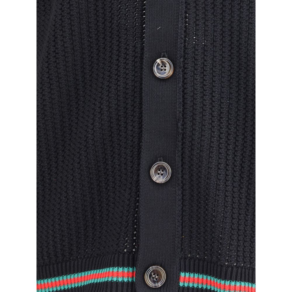 Black Cotton CardiganCotton cardigan from Gucci features a V-neck front and front button closure for a classic, refined style. Raglan sleeves ensure comfort and freedom of movement, while the knit weave lends a touch of elegant texture. Ribbed cuffs and h