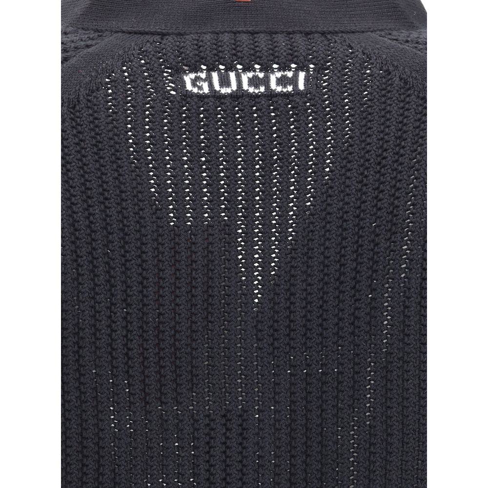 Black Cotton CardiganCotton cardigan from Gucci features a V-neck front and front button closure for a classic, refined style. Raglan sleeves ensure comfort and freedom of movement, while the knit weave lends a touch of elegant texture. Ribbed cuffs and h