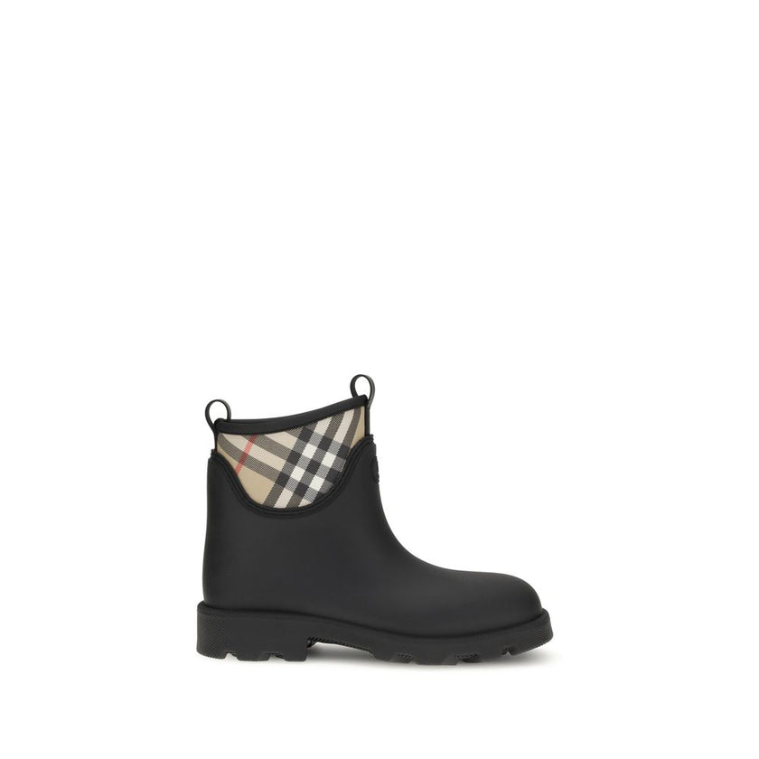 Black Rubber Ankle BootsBurberry’s Marsh Stamp Ankle Boots combine functionality with iconic style. Made of rubber, they are woven with the Burberry Check pattern in the classic sand color. The round toe and compact design make them ideal for rainy days,
